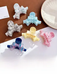 Detailed set of six colorful hollow bow hair claws in vibrant floral and gradient colors