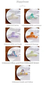 Macro detail of large acetate flower hair claw clips with elegant pearl edge accents