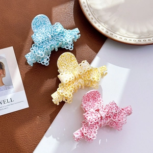 Acetate lace bow hair clips in light blue, bright yellow, and cherry pink colors