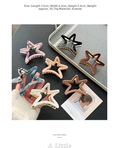 Detailed view of 7.5cm star-shaped acetate hair claw clip with colorful marble pattern