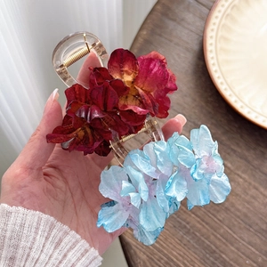 Elegant camellia flower hair clips in red and blue fabric with strong grip springs
