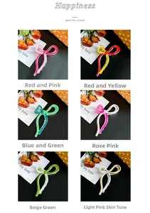 Detail showing bow-shaped hair claw clips in six colors with elegant props and soft lighting