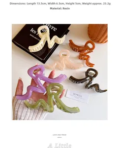 Detailed view of large resin wave hair claw clip measuring 13.5cm in olive green