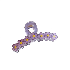 Pince à cheveux fleurie violette translucide avec motifs de marguerites et ressort