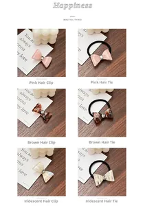 Detailed view of resin bow hair clips and ties in pink, marble, and shell patterns
