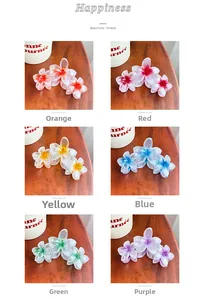 Vue détaillée de six pinces à cheveux fleurs dégradées en orange, rouge, jaune, bleu et violet