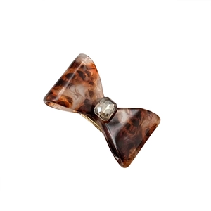 Vintage tortoiseshell bow hair clip with crystal center and gold metal duckbill clip