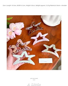 Set of five star-shaped acetate hair claws in various colors with product dimensions