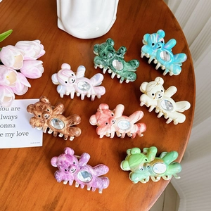 Set of eight colorful marble pattern bear hair claws with crystal rhinestones