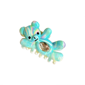 Iridescent light blue bear hair claw clip with large crystal and white teeth