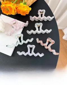 Set of 6 wavy claw clips with heart handles featuring marble textures and pastel colors