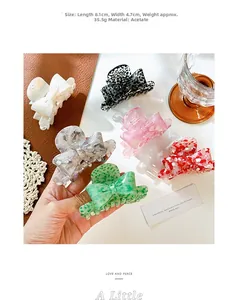 Detailed view of assorted acetic acid bow hair claws in six vibrant marble patterns