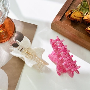 Pinces à cheveux nœud en acétate crème et rose avec texture marbrée élégante