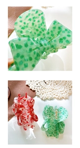 Close-up of acetic acid bow hair claw clips with unique spotted patterns and textures