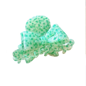 Elegant green leopard print acetate bow hair claw clip for a stylish back head hair styling