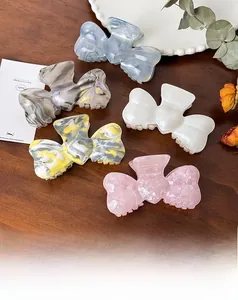 Detail of high-quality acetate butterfly claw clips in five elegant marble colors