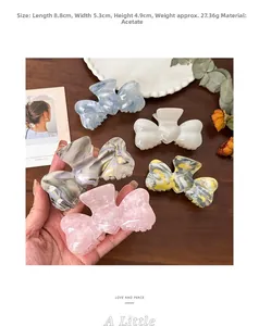 Detail showing various acetate bow hair claws in five colors with dimensions 8.8x5.3x4.9cm