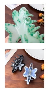 Detailed view of butterfly claw clips with acetic acid patterns and metal springs