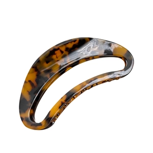 Large acetate hair claw clip with tortoise shell leopard pattern in crescent moon shape
