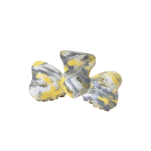 Elegant acetate bow hair claw clip with marble texture and large shark clip design