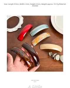 Set of six colorful acetate hair barrettes on wood background showing size 9.9cm