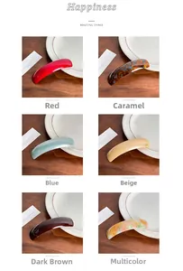 Macro view of six colors large resin spring hair clips displayed on a white plate