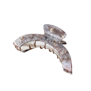 Elegant large marble textured acetate hair claw clip with a curved half-moon design