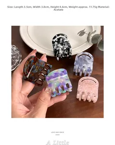 Detailed view of cellulose acetate hair claw clip showing 3.5cm size and marble texture