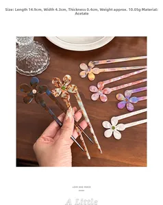 Detail view of acetate flower hair pin showing dimensions 14.9cm length and floral texture