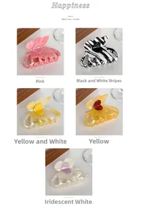 Detail showing five colors of acetate butterfly hair claws including pink and striped patterns