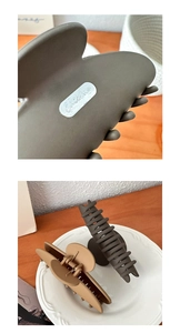 Detailed macro shot of the matte resin hair claws with a silver Chicme metal logo plate