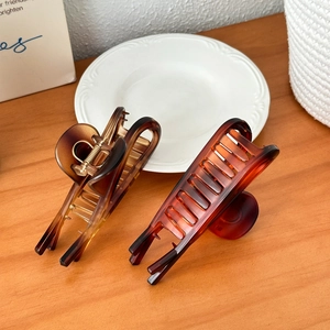 Set of two vintage tortoiseshell hair claw clips in amber and dark brown colors