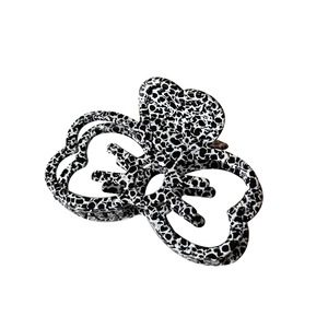 Elegant hollow butterfly hair claw clip with black and white acetate marble pattern