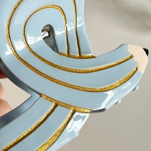 Creative blue acetate hair claw clip with gold glitter stripes in a stylish pencil design
