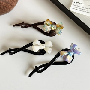 Three-piece set of elegant acetate bow hair clips with rhinestones in marble patterns