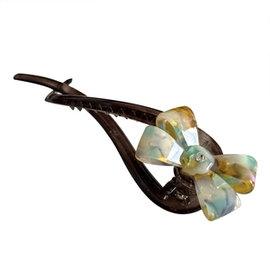 Elegant tortoiseshell acetate bow banana hair clip with marble pattern and rhinestone