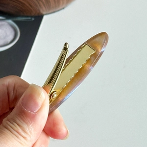 Elegant amber acetate duckbill hair clip with golden metal grip for women fashion