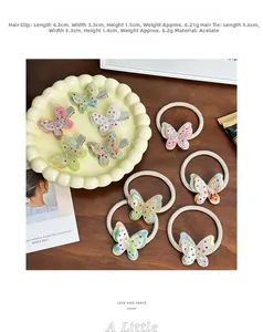 Detailed view of pastel acetate butterfly hair clips and ties with colorful rhinestones