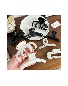 Polka dot hair claw clip set made of durable resin in black and white patterns