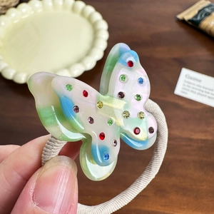 Sweet butterfly hair tie with colorful pearlescent resin and sparkling rhinestones inlay