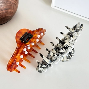 Large tortoiseshell and marble acetate hair claws with elegant pearl embellishments