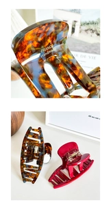 Macro detail of tortoiseshell acetate claw clip with gold FRANCE Handmade lettering