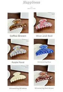 Detailed close-up of shell-shaped hair claws with decorative pearls in six colors