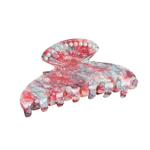 Pink and blue marble shell hair claw clip with white pearl accents on white background
