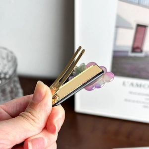 Cloud-shaped iridescent purple acrylic hair clip with gold metal duckbill grip
