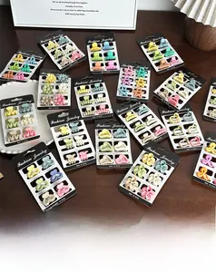 Detail of colorful macaron matte hair clips in flower and star shapes on a card