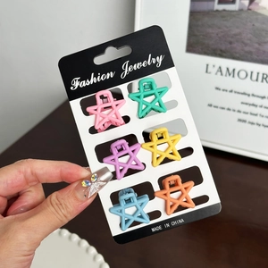 Set of six colorful star-shaped matte mini hair claws for women in macaron colors