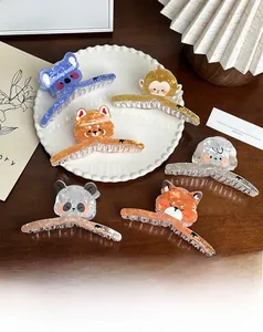Detailed macro view of assorted animal acetate hair claws in a decorative white plate