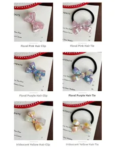 Detail of acetate bow hair ties and clips with marble patterns and inlaid rhinestones