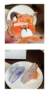 Detail of cute animal-shaped hair claw clips with marble texture and premium metal spring